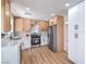 This bright kitchen features stainless steel appliances, white countertops, light cabinets, and modern hardware at 9321 Dancing Daffodil Ave, Las Vegas, NV 89129