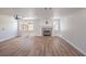 Open concept living room with fireplace and new laminate flooring at 9321 Dancing Daffodil Ave, Las Vegas, NV 89129
