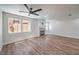 Open concept living room with fireplace and new laminate flooring at 9321 Dancing Daffodil Ave, Las Vegas, NV 89129