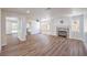 Open concept living room with fireplace and new laminate flooring at 9321 Dancing Daffodil Ave, Las Vegas, NV 89129