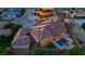 Wonderful aerial view of the home showcasing the tile roof and outdoor entertaining area with pool at 9865 Bright Angel Way, Las Vegas, NV 89149
