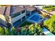 Aerial view of the backyard showing a beautiful pool, hot tub, and outdoor kitchen at 9865 Bright Angel Way, Las Vegas, NV 89149