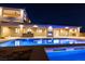 Gorgeous backyard showcasing a shimmering pool and a well-appointed outdoor kitchen area at 9865 Bright Angel Way, Las Vegas, NV 89149