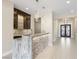 Modern bar area features stone accents, custom cabinets, and stylish lighting at 9865 Bright Angel Way, Las Vegas, NV 89149