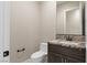 Stylish bathroom featuring a modern vanity with marble countertops and sleek fixtures at 9865 Bright Angel Way, Las Vegas, NV 89149