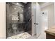 Sleek bathroom with a modern shower design and elegant marble tile at 9865 Bright Angel Way, Las Vegas, NV 89149