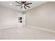 Cozy bedroom boasts neutral walls, bright recessed lighting, ceiling fan, and durable wood-look tile flooring at 9865 Bright Angel Way, Las Vegas, NV 89149