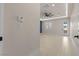 Inviting bedroom features bright tile floor, contemporary ceiling fan, and lots of natural light at 9865 Bright Angel Way, Las Vegas, NV 89149