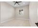 A neutral toned bedroom features a ceiling fan and a shuttered window for natural light at 9865 Bright Angel Way, Las Vegas, NV 89149