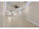 A versatile bonus room with recessed lighting, ceiling fan and light wood-look tile floor at 9865 Bright Angel Way, Las Vegas, NV 89149