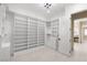 Spacious walk-in closet with custom shelving and drawers provides ample storage at 9865 Bright Angel Way, Las Vegas, NV 89149
