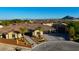 Beautiful single-story home showcasing desert landscaping, a tiled roof, and three-car garage at 9865 Bright Angel Way, Las Vegas, NV 89149