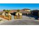 Stunning single-story home featuring a tile roof, desert landscaping, and a three-car garage at 9865 Bright Angel Way, Las Vegas, NV 89149