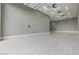 Expansive garage with high ceilings, bright lighting, and durable flooring for versatile use at 9865 Bright Angel Way, Las Vegas, NV 89149