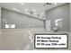 Large garage equipped with RV hookups, an alarm system, ample lighting, and three ceiling fans for convenience at 9865 Bright Angel Way, Las Vegas, NV 89149