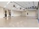 Expansive garage with high ceilings, ample lighting, and convenient access, perfect for storage or hobbies at 9865 Bright Angel Way, Las Vegas, NV 89149