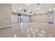 Bright garage featuring durable floors, ample lighting, and tall ceilings for versatile use and storage at 9865 Bright Angel Way, Las Vegas, NV 89149