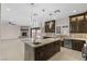 Open concept kitchen with large island and stainless steel appliances at 9865 Bright Angel Way, Las Vegas, NV 89149