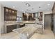 Gourmet kitchen featuring stainless steel appliances and a large island at 9865 Bright Angel Way, Las Vegas, NV 89149