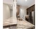 Modern kitchen with granite countertop, stainless steel appliances, and sleek fixtures at 9865 Bright Angel Way, Las Vegas, NV 89149