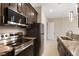 Well-equipped kitchen featuring stainless steel appliances, granite countertops, and ample cabinet space at 9865 Bright Angel Way, Las Vegas, NV 89149