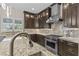 Modern kitchen features custom cabinets, marble countertops, and a stainless steel range at 9865 Bright Angel Way, Las Vegas, NV 89149