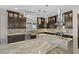 Bright kitchen with custom lighting, marble countertops, and stainless steel appliances at 9865 Bright Angel Way, Las Vegas, NV 89149