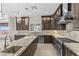 Stylish kitchen featuring an island with a sink and stainless steel appliances at 9865 Bright Angel Way, Las Vegas, NV 89149