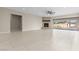 Expansive living room with a fireplace and sliding doors to backyard at 9865 Bright Angel Way, Las Vegas, NV 89149