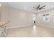 Spacious living room featuring a ceiling fan, natural light, and a view of the outdoor patio at 9865 Bright Angel Way, Las Vegas, NV 89149