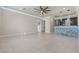 Spacious living room with a wet bar, decorative lighting, and neutral finishes at 9865 Bright Angel Way, Las Vegas, NV 89149