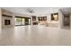 Bright and airy living space with fireplace, an open layout and access to the outdoor pool area at 9865 Bright Angel Way, Las Vegas, NV 89149