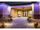 Charming outdoor space with stone pathway, fire pit, and soft lighting for evening relaxation at 9865 Bright Angel Way, Las Vegas, NV 89149