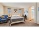 Bright bedroom with carpeting, natural light, and a full ensuite bathroom with a glass shower at 987 Wembly Hills Pl, Henderson, NV 89011