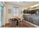 Cozy dining area features a round table, modern chairs, and stylish pendant lighting at 987 Wembly Hills Pl, Henderson, NV 89011