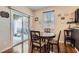 The dining area features a sliding glass door for natural light and backyard access at 987 Wembly Hills Pl, Henderson, NV 89011