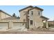 Two-story home showcasing a two-car garage, desert landscaping, and a well-maintained exterior at 987 Wembly Hills Pl, Henderson, NV 89011