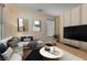 Bright living room with neutral walls, modern decor, and large windows for natural light at 987 Wembly Hills Pl, Henderson, NV 89011