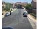 A view of a suburban neighborhood street with mountains in the distance at 987 Wembly Hills Pl, Henderson, NV 89011