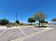 Parking area for the community green with mature trees and landscaping under a clear sky at 987 Wembly Hills Pl, Henderson, NV 89011