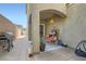 The patio has a grill, seating, and access to the house, perfect for entertaining and enjoying the outdoors at 987 Wembly Hills Pl, Henderson, NV 89011