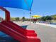 Colorful community playground featuring slides, swings, and water features for Gathering fun at 987 Wembly Hills Pl, Henderson, NV 89011