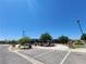 Community tennis courts with mature trees and landscaping under a clear sky at 987 Wembly Hills Pl, Henderson, NV 89011
