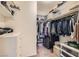 A spacious walk-in closet with organized shelves and hanging space at 987 Wembly Hills Pl, Henderson, NV 89011