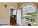 Cozy balcony with an arched entrance, offering a view of the community and outdoor space at 9975 Peace Way # 1069, Las Vegas, NV 89147