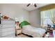 Charming bedroom with natural light features cozy decor and ample storage with a large dresser at 9975 Peace Way # 1069, Las Vegas, NV 89147