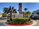 Inviting community entrance with lush landscaping and clear signage for Chateau Nouveau at 9975 Peace Way # 1069, Las Vegas, NV 89147