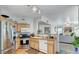 Modern kitchen with stainless steel appliances offers an easy transition to the living room for gatherings at 9975 Peace Way # 1069, Las Vegas, NV 89147