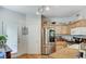 Well-lit kitchen features stainless steel appliances, ample cabinet space, and convenient access to the backyard at 9975 Peace Way # 1069, Las Vegas, NV 89147