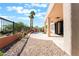 Backyard patio with desert landscaping, rocks, water feature, and patio cover at 1016 Eaglewood Dr, Las Vegas, NV 89144